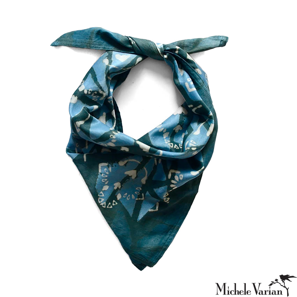 Blue patterned bandana on a white background.
