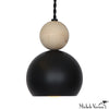 Pendant light with black and beige spherical shades on a white background, designed by Michele Varian.