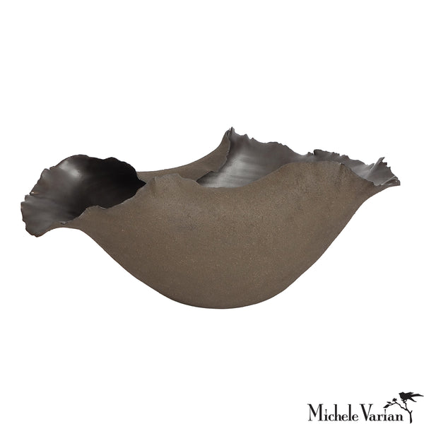 Decorative bowl with an organic wavy edge design on a white background