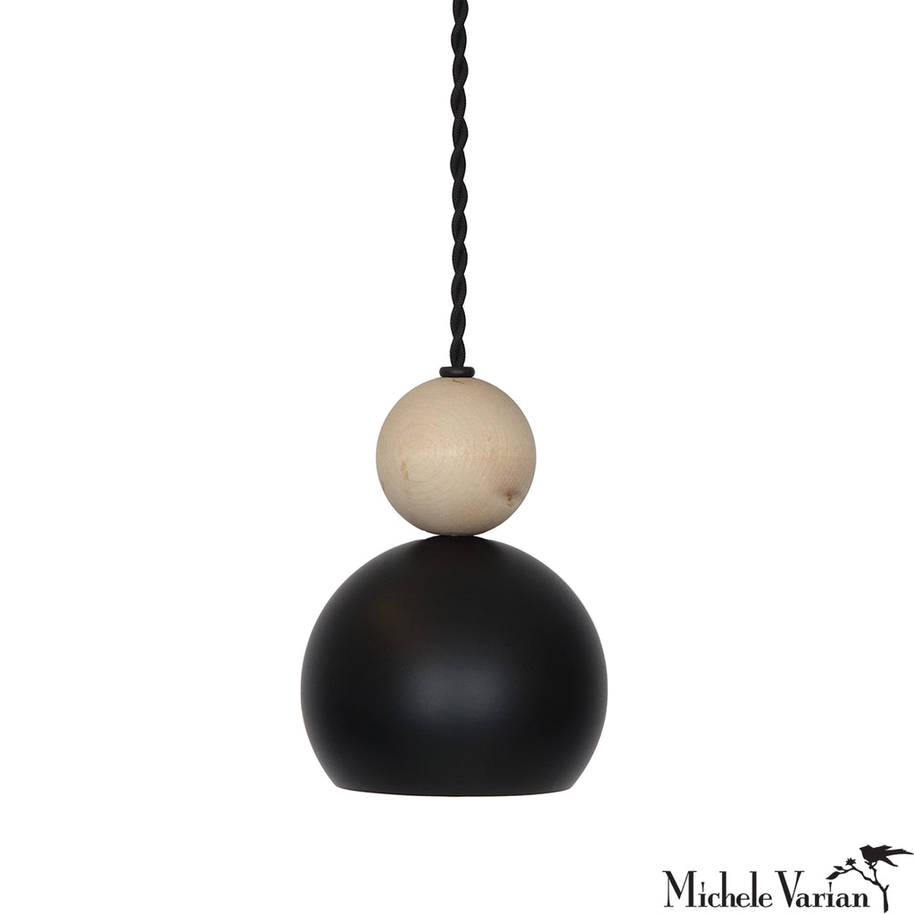 Black and beige pendant light with a white background