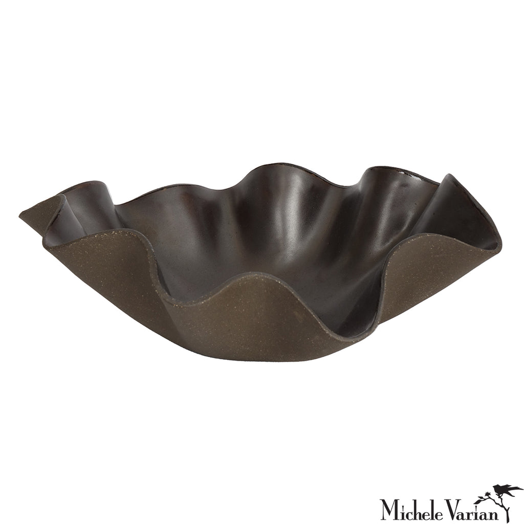 Brown wavy bowl on a white background
