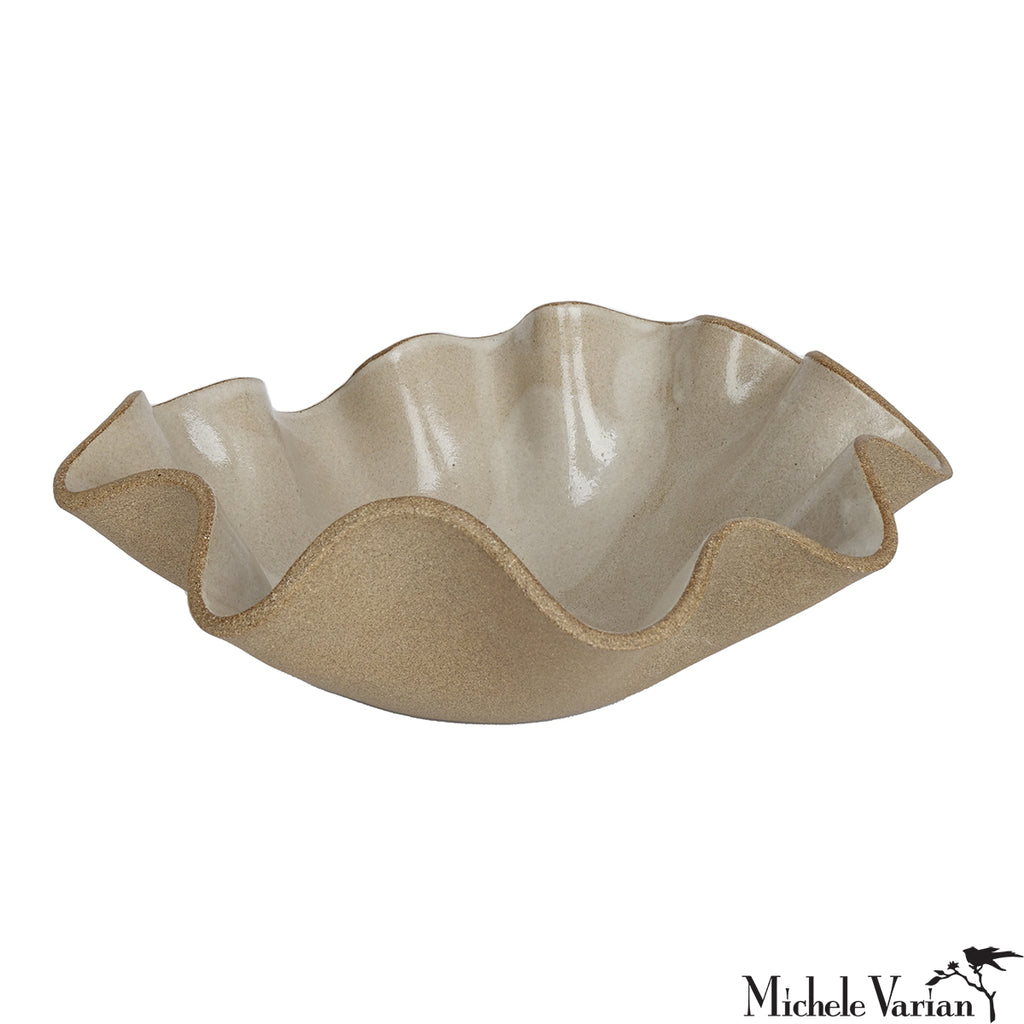 Decorative bowl with wavy edge on a white background