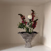 Decorative vase with flowers on a neutral background
