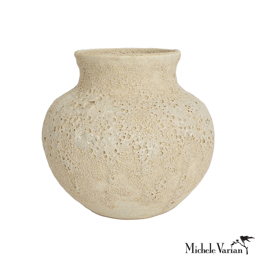 Beige textured vase on a white background