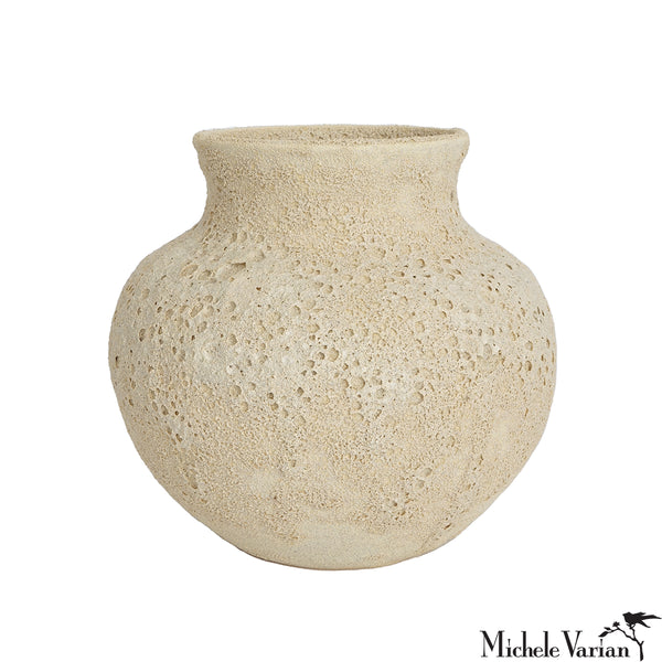 Beige textured vase on a white background