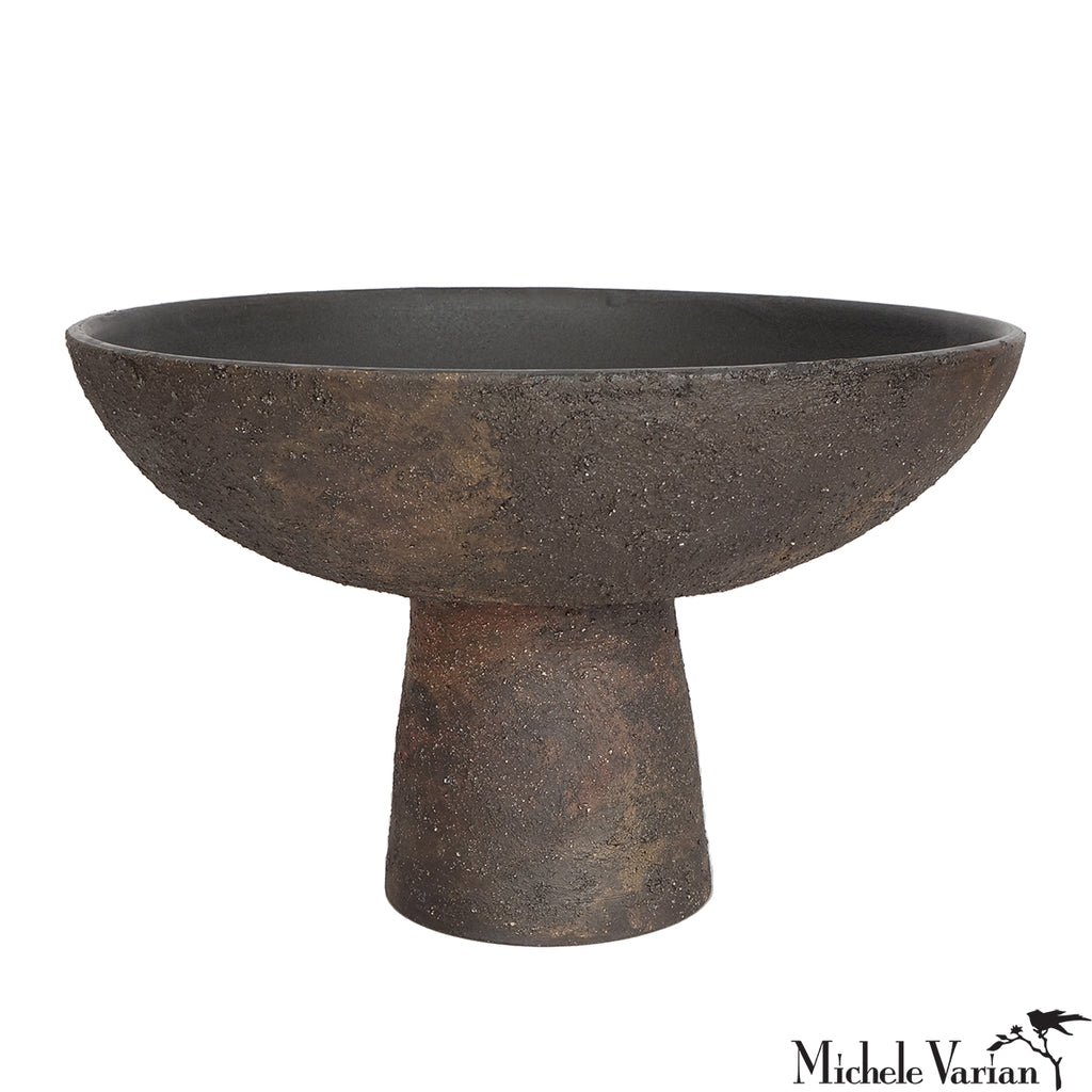 Decorative bowl with a pedestal base on a white background