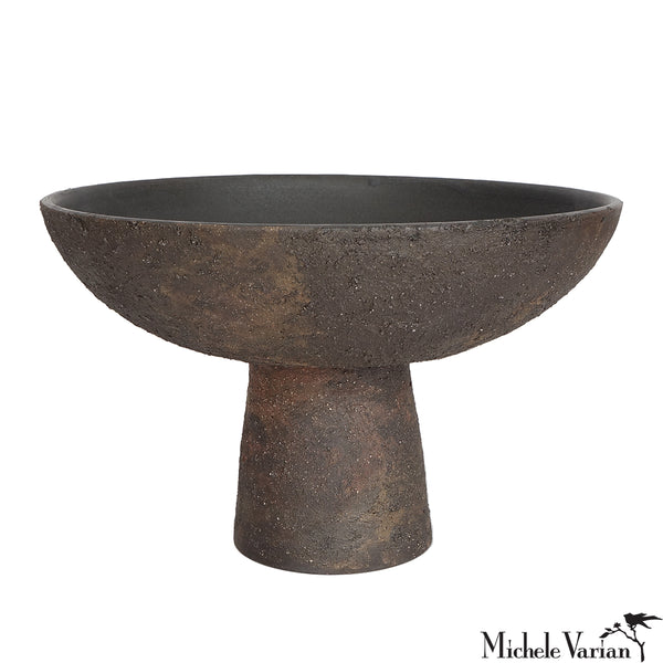 Decorative bowl with a pedestal base on a white background