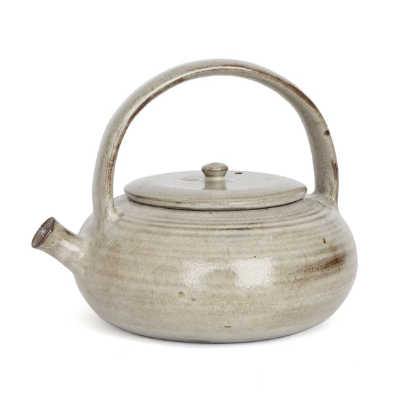 Ceramic teapot with a lid on a white background